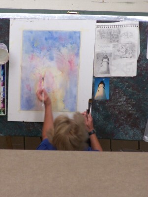 After the gesso was dry, Susan applied a mid-value wash all over.  Here Susan is shown lifting the watercolor on the light side of the lighthouse.  She reminded us to be sure not to use staining color